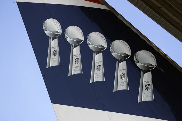 Images of the Lombardi trophy are seen on the tail of the New England Patriots' team plane as the team arrives for the NFL Super Bowl 52 football game Monday, Jan. 29, 2018, in Minneapolis. New England is scheduled to face the Philadelphia Eagles Sunday. (AP Photo/Eric Gay)