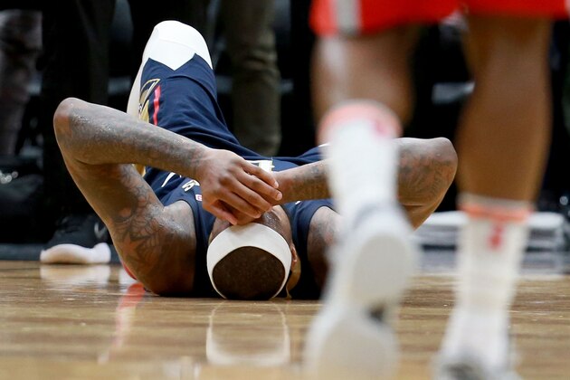 NEW ORLEANS, LA - JANUARY 26:  DeMarcus Cousins #0 of the New Orleans Pelicans lies down on the ground after injuring his ankle during the second half of a NBA game against the Houston Rockets at the Smoothie King Center on January 26, 2018 in New Orleans, Louisiana. NOTE TO USER: User expressly acknowledges and agrees that, by downloading and or using this photograph, User is consenting to the terms and conditions of the Getty Images License Agreement.  (Photo by Sean Gardner/Getty Images)