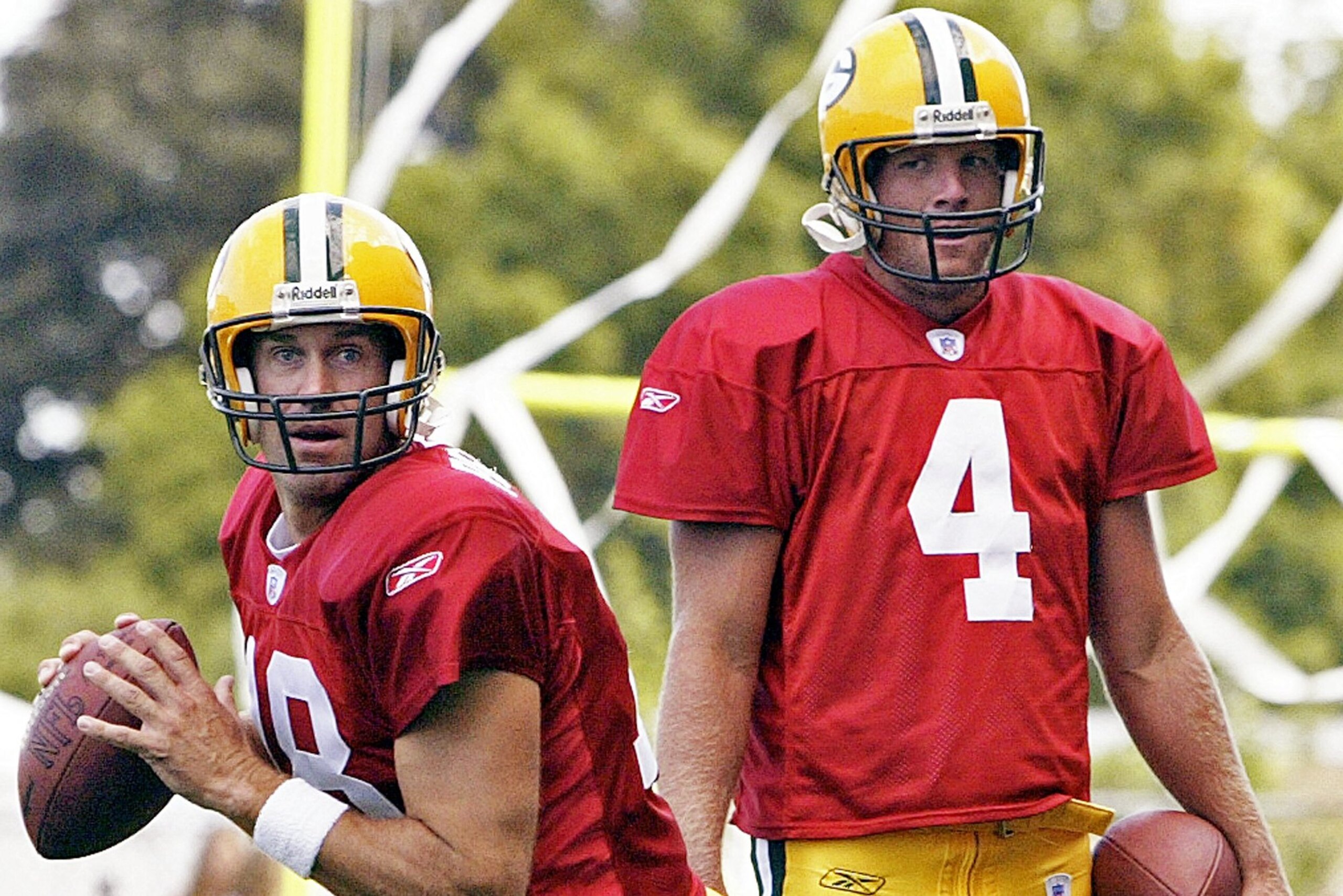 Green Bay Packers quarterback Brett Favre watches Doug Pederson (18) drop back for a pass at training camp, Wednesday, Aug. 4, 2004, in Green Bay, Wis. (AP Photo/Morry Gash)