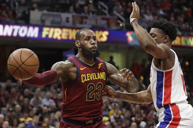 Cleveland Cavaliers' LeBron James (23) passes against Detroit Pistons' Stanley Johnson (7) in the first half of an NBA basketball game, Sunday, Jan. 28, 2018, in Cleveland. (AP Photo/Tony Dejak)