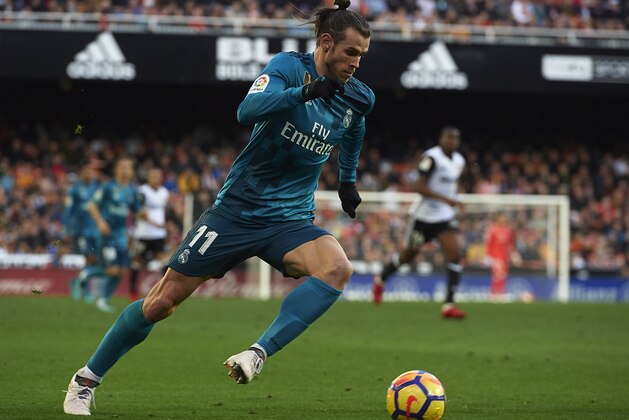 VALENCIA, SPAIN - JANUARY 27:  Gareth Bale of Real Madrid runs with the ball during the La Liga match between Valencia and Real Madrid at Estadio Mestalla on January 27, 2018 in Valencia, Spain.  (Photo by Quality Sport Images/Getty Images,)