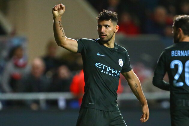 Manchester City's Argentinian striker Sergio Aguero celebrates after scoring their second goal during the English League Cup semi-final, second leg football match between Bristol City and Manchester City at Ashton Gate Stadium in Bristol, south-west England on January 23, 2018. / AFP PHOTO / Geoff CADDICK / RESTRICTED TO EDITORIAL USE. No use with unauthorized audio, video, data, fixture lists, club/league logos or 'live' services. Online in-match use limited to 75 images, no video emulation. No use in betting, games or single club/league/player publications.  /         (Photo credit should read GEOFF CADDICK/AFP/Getty Images)