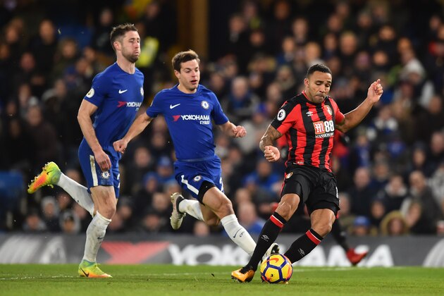 Bournemouth's English striker Callum Wilson (R) scores the team's first goal during the English Premier League football match between Chelsea and Bournemouth at Stamford Bridge in London on January 31, 2018. / AFP PHOTO / Glyn KIRK / RESTRICTED TO EDITORIAL USE. No use with unauthorized audio, video, data, fixture lists, club/league logos or 'live' services. Online in-match use limited to 75 images, no video emulation. No use in betting, games or single club/league/player publications.  /         (Photo credit should read GLYN KIRK/AFP/Getty Images)