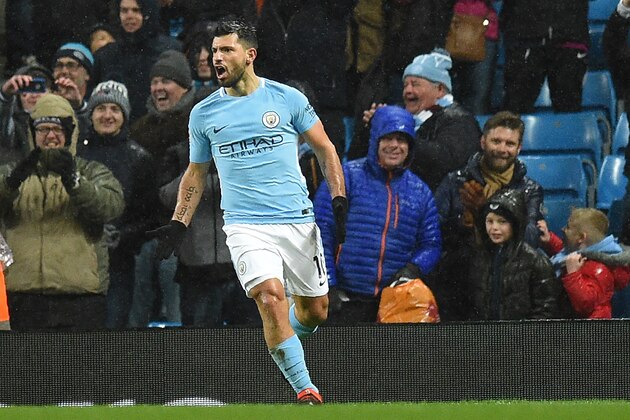 Manchester City's Argentinian striker Sergio Aguero celebrates after scoring their third goal during the English Premier League football match between Manchester City and West Bromwich Albion at the Etihad Stadium in Manchester, north west England, on January 31, 2018.
Manchester City won the game 3-0. / AFP PHOTO / Oli SCARFF / RESTRICTED TO EDITORIAL USE. No use with unauthorized audio, video, data, fixture lists, club/league logos or 'live' services. Online in-match use limited to 75 images, no video emulation. No use in betting, games or single club/league/player publications.  /         (Photo credit should read OLI SCARFF/AFP/Getty Images)