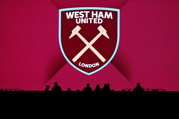 LONDON, ENGLAND - OCTOBER 20: Silhoutte of fans infront of the West Ham Badge during the Premier League match between West Ham United and Brighton and Hove Albion at London Stadium on October 20, 2017 in London, England. (Photo by Catherine Ivill - AMA/Getty Images)