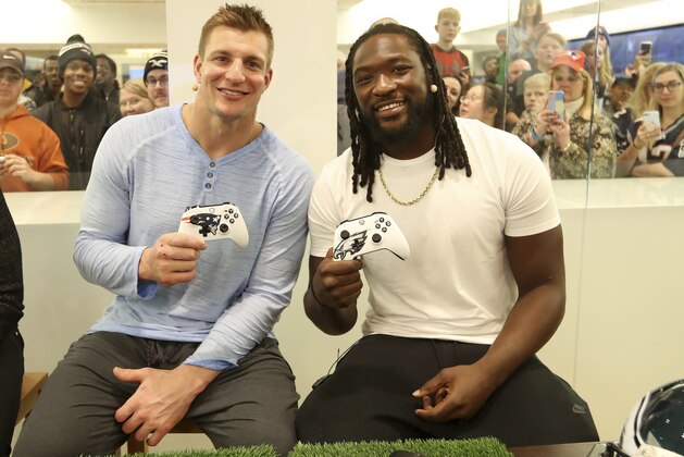 IMAGE DISTRIBUTED FOR MICROSOFT - New England Patriots Rob Gronkowski and Philadelphia Eagles LeGarrette Blount join Xbox Live Sessions: Super Bowl Edition at the Microsoft Store at Mall of America on January 30, 2018 (Jeff Lewis/AP Images for Microsoft)