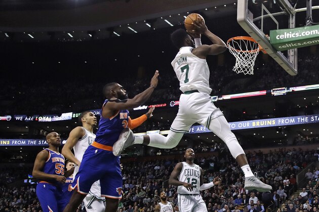 Boston Celtics guard Jaylen Brown (7) drives to the basket past New York Knicks forward Tim Hardaway Jr. (3) during the second quarter of an NBA basketball game in Boston, Wednesday, Jan. 31, 2018. (AP Photo/Charles Krupa)