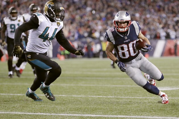 New England Patriots wide receiver Danny Amendola (80) runsto the end zone against Jacksonville Jaguars linebacker Myles Jack (44) for a touchdown after catching a pass during the second half of the AFC championship NFL football game, Sunday, Jan. 21, 2018, in Foxborough, Mass. (AP Photo/David J. Phillip)