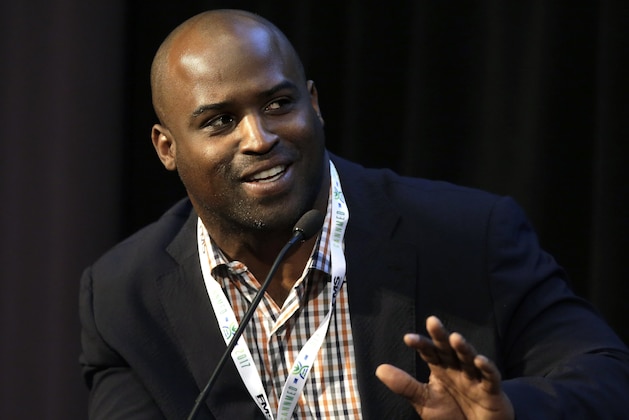 Former NFL football player Ricky Williams, who played for the New Orleans Saints and the Miami Dolphins among other teams, addresses an audience during a conference on medical marijuana at Harvard Medical School, Tuesday, April 11, 2017, in Boston. (AP Photo/Steven Senne)