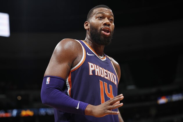 Phoenix Suns center Greg Monroe argues a call with a referee during the second half of the team's NBA basketball game against the Denver Nuggets on Wednesday, Jan. 3, 2018, in Denver. The Nuggets won 134-111. (AP Photo/David Zalubowski)