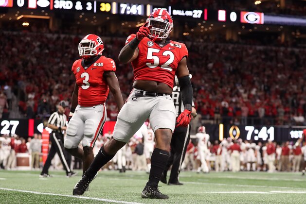 ATLANTA, GA - JANUARY 08: Tyler Clark #52 and Roquan Smith #3 of the Georgia Bulldogs celebrate a stop against the Alabama Crimson Tide during the first quarter in the CFP National Championship presented by AT&T at Mercedes-Benz Stadium on January 8, 2018 in Atlanta, Georgia.  (Photo by Christian Petersen/Getty Images)