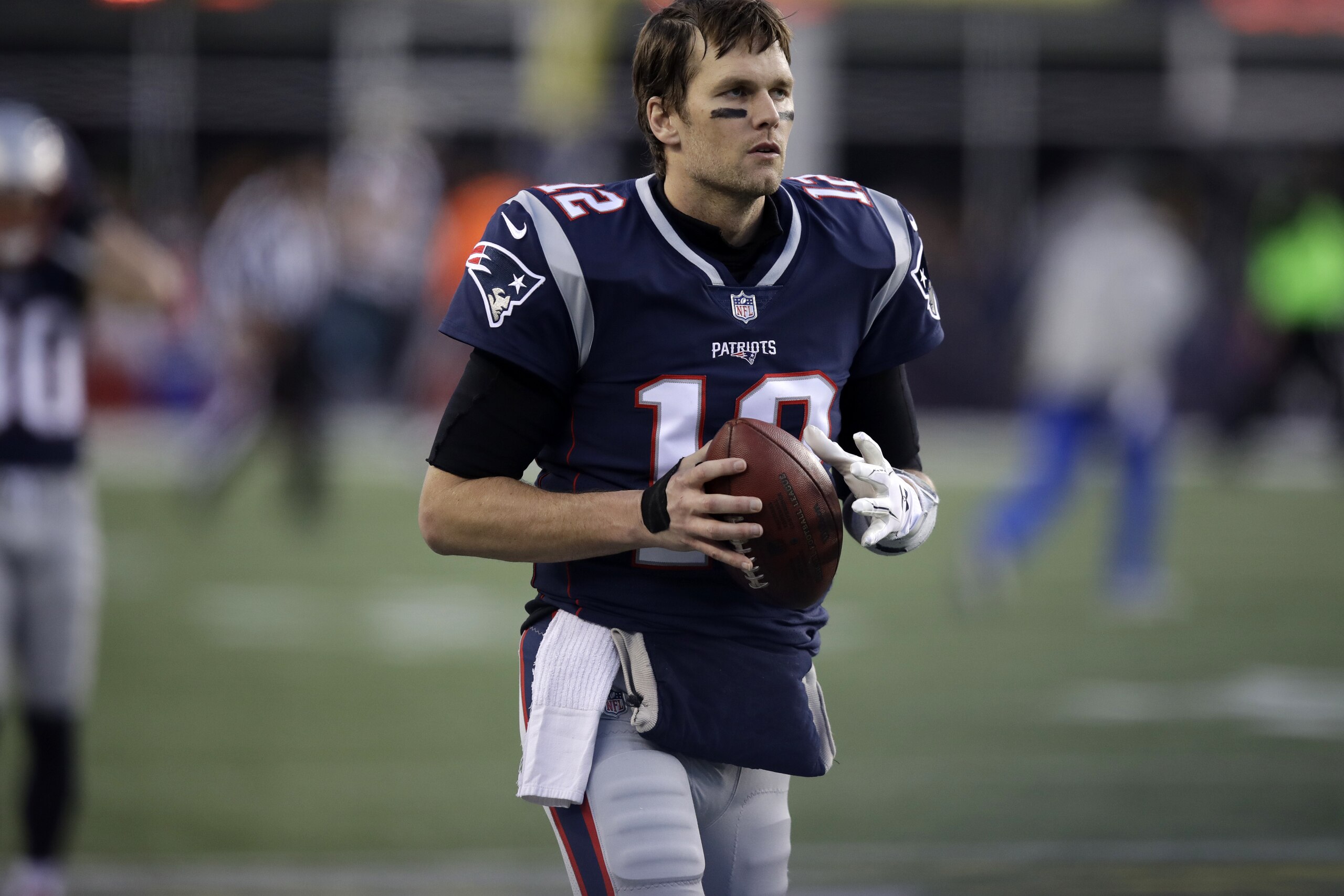 New England Patriots quarterback Tom Brady (12) warms up before the second half of the AFC championship NFL football game against the Jacksonville Jaguars, Sunday, Jan. 21, 2018, in Foxborough, Mass. (AP Photo/Charles Krupa)