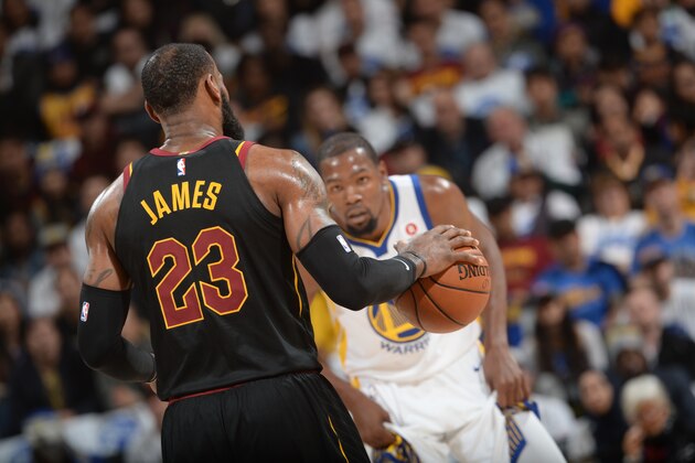 OAKLAND, CA - DECEMBER 25:   LeBron James #23 of the Cleveland Cavaliers handles the ball against Kevin Durant #35 of the Golden State Warriors on December 25, 2017 at ORACLE Arena in Oakland, California. NOTE TO USER: User expressly acknowledges and agrees that, by downloading and or using this photograph, user is consenting to the terms and conditions of Getty Images License Agreement. Mandatory Copyright Notice: Copyright 2017 NBAE (Photo by Noah Graham/NBAE via Getty Images)