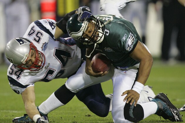 New England Patriots' Tedy Bruschi sacks Philadelphia Eagles quarterback Donovan McNabb in the first quarter of Super Bowl XXXIX in Jacksonville, Fla., Sunday, Feb. 6, 2005. Officials initially ruled that McNabb fumbled the ball, but the call was reversed after a challenge by Philadelphia. (AP Photo/Chris O'Meara)