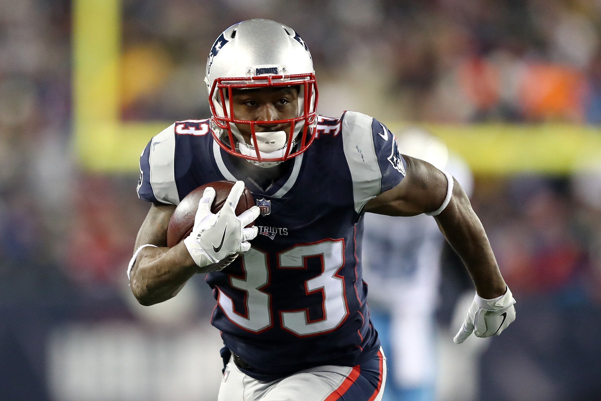 FOXBOROUGH, MA - JANUARY 13: Dion Lewis #33 of the New England Patriots carries the ball in the second quarter of the AFC Divisional Playoff game against the Tennessee Titans at Gillette Stadium on January 13, 2018 in Foxborough, Massachusetts. (Photo by Elsa/Getty Images) FOXBOROUGH, MA - JANUARY 13: Dion Lewis #33 of the New England Patriots carries the ball in the second quarter of the AFC Divisional Playoff game against the Tennessee Titans at Gillette Stadium on January 13, 2018 in Foxborough, Massachusetts. (Photo by Elsa/Getty Images)