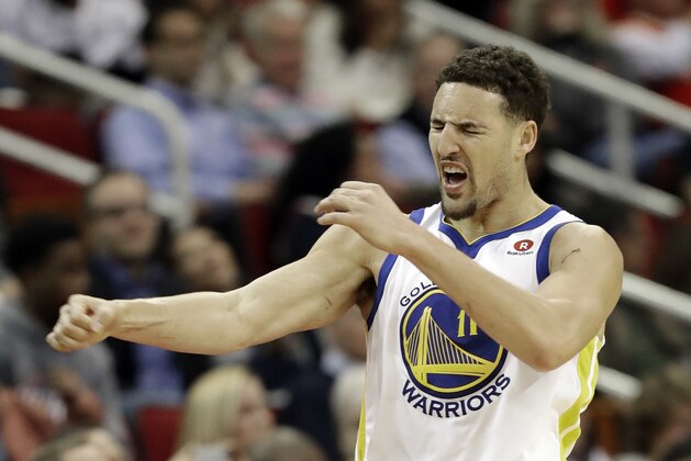 Golden State Warriors' Klay Thompson reacts after making a 3-point basket during the second half of an NBA basketball game against the Houston Rockets Thursday, Jan. 4, 2018, in Houston. The Warriors won 124-114.(AP Photo/David J. Phillip)
