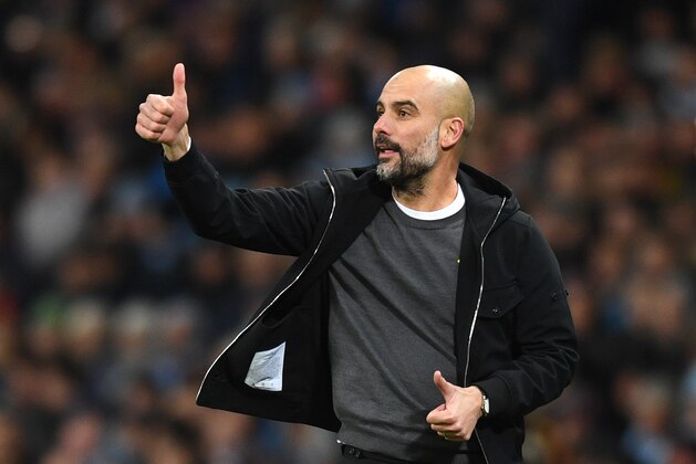 MANCHESTER, ENGLAND - JANUARY 31:  Josep Guardiola, Manager of Manchester City gives his team instructions during the Premier League match between Manchester City and West Bromwich Albion at Etihad Stadium on January 31, 2018 in Manchester, England.  (Photo by Michael Regan/Getty Images)