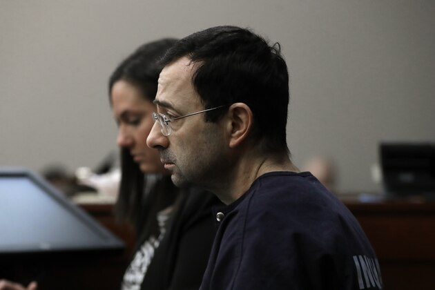 Dr. Larry Nassar listens as a victim gives her impact statement during the seventh day of his sentencing hearing Wednesday, Jan. 24, 2018, in Lansing, Mich. Nassar has admitted sexually assaulting athletes when he was employed by Michigan State University and USA Gymnastics, which is the sport's national governing organization and trains Olympians. (AP Photo/Carlos Osorio)