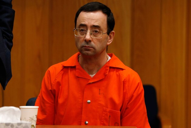Former Michigan State University and USA Gymnastics doctor Larry Nassar listens during the sentencing phase in Eaton, County Circuit Court on January 31, 2018 in Charlotte, Michigan. Last week Nassar was sentenced in Ingham County to 40 years to 175 years in prison.
The number of identified sexual abuse victims of former USA Gymnastics doctor Larry Nassar has grown to 265, a Michigan judge announced Wednesday as a final sentencing hearing commenced. Prosecutors said at least 65 victims were to confront Nassar in court, in the last of three sentencing hearings for the disgraced doctor who molested young girls and women for two decades in the guise of medical treatment.
 / AFP PHOTO / JEFF KOWALSKY        (Photo credit should read JEFF KOWALSKY/AFP/Getty Images)