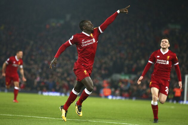 Liverpool's Sadio Mane celebrates scoring his side's third goal during the English Premier League soccer match between Liverpool and Manchester City at Anfield Stadium, in Liverpool, England, Sunday Jan. 14, 2018. (AP Photo/Dave Thompson)