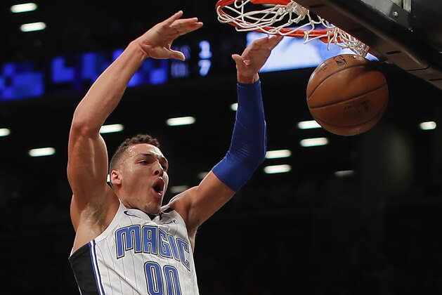 Orlando Magic forward Aaron Gordon (00) dunks the ball against the Brooklyn Nets during the first quarter of an NBA basketball game, Monday, Jan. 1, 2018, in New York. (AP Photo/Julie Jacobson)
