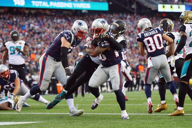 FOXBOROUGH, MA - JANUARY 21:  James White #28 of the New England Patriots scores a touchdown in the second quarter  during the AFC Championship Game against the Jacksonville Jaguars at Gillette Stadium on January 21, 2018 in Foxborough, Massachusetts.  (Photo by Maddie Meyer/Getty Images)