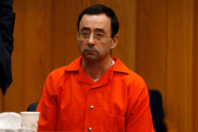 Former Michigan State University and USA Gymnastics doctor Larry Nassar listens during the sentencing phase in Eaton, County Circuit Court on January 31, 2018 in Charlotte, Michigan. Last week Nassar was sentenced in Ingham County to 40 years to 175 years in prison.
The number of identified sexual abuse victims of former USA Gymnastics doctor Larry Nassar has grown to 265, a Michigan judge announced Wednesday as a final sentencing hearing commenced. Prosecutors said at least 65 victims were to confront Nassar in court, in the last of three sentencing hearings for the disgraced doctor who molested young girls and women for two decades in the guise of medical treatment.
 / AFP PHOTO / JEFF KOWALSKY        (Photo credit should read JEFF KOWALSKY/AFP/Getty Images)
