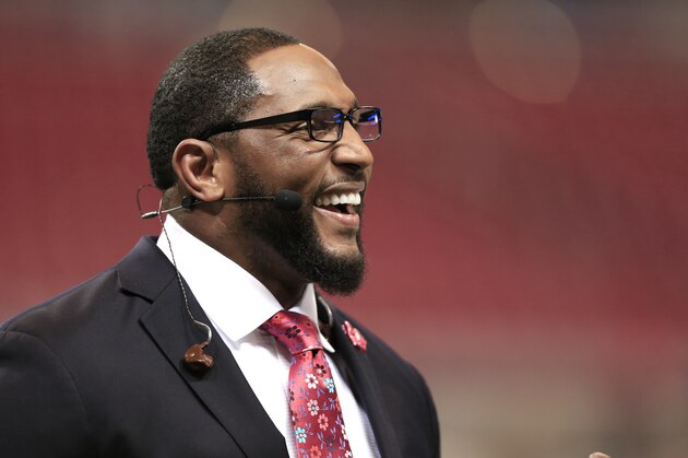 Television broadcaster and former Baltimore Raven Ray Lewis works before an NFL football game between the St. Louis Rams and the San Francisco 49ers Monday, Oct. 13, 2014, in St Louis. (AP Photo/Billy Hurst)