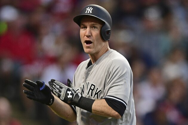 New York Yankees' Todd Frazier celebrates after hitting a solo home run off Cleveland Indians starting pitcher Trevor Bauer in the fifth inning of a baseball game, Friday, Aug. 4, 2017, in Cleveland. (AP Photo/David Dermer)