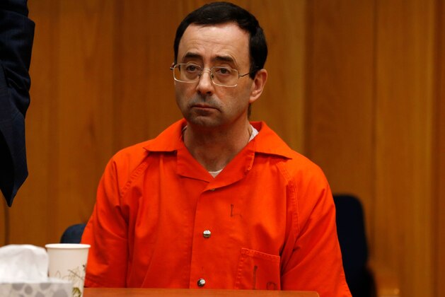 Former Michigan State University and USA Gymnastics doctor Larry Nassar listens during the sentencing phase in Eaton, County Circuit Court on January 31, 2018 in Charlotte, Michigan. Last week Nassar was sentenced in Ingham County to 40 years to 175 years in prison.
The number of identified sexual abuse victims of former USA Gymnastics doctor Larry Nassar has grown to 265, a Michigan judge announced Wednesday as a final sentencing hearing commenced. Prosecutors said at least 65 victims were to confront Nassar in court, in the last of three sentencing hearings for the disgraced doctor who molested young girls and women for two decades in the guise of medical treatment.
 / AFP PHOTO / JEFF KOWALSKY        (Photo credit should read JEFF KOWALSKY/AFP/Getty Images)