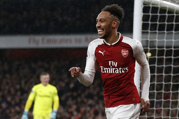 Arsenal's Gabonese striker Pierre-Emerick Aubameyang celebrates scoring the team's fourth goal during the English Premier League football match between Arsenal and Everton at the Emirates Stadium in London on February 3, 2018.  / AFP PHOTO / IKIMAGES / Ian KINGTON / RESTRICTED TO EDITORIAL USE. No use with unauthorized audio, video, data, fixture lists, club/league logos or 'live' services. Online in-match use limited to 45 images, no video emulation. No use in betting, games or single club/league/player publications.  /         (Photo credit should read IAN KINGTON/AFP/Getty Images)