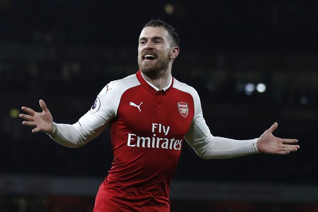 Arsenal's Welsh midfielder Aaron Ramsey celebrates scoring the team's fifth goal during the English Premier League football match between Arsenal and Everton at the Emirates Stadium in London on February 3, 2018.  / AFP PHOTO / Adrian DENNIS / RESTRICTED TO EDITORIAL USE. No use with unauthorized audio, video, data, fixture lists, club/league logos or 'live' services. Online in-match use limited to 75 images, no video emulation. No use in betting, games or single club/league/player publications.  /         (Photo credit should read ADRIAN DENNIS/AFP/Getty Images)