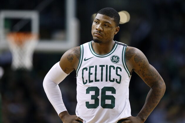 Boston Celtics' Marcus Smart stands on the court during the fourth quarter of an NBA basketball game against the Philadelphia 76ers in Boston, Thursday, Jan. 18, 2018. The 76ers won 89-80. (AP Photo/Michael Dwyer)