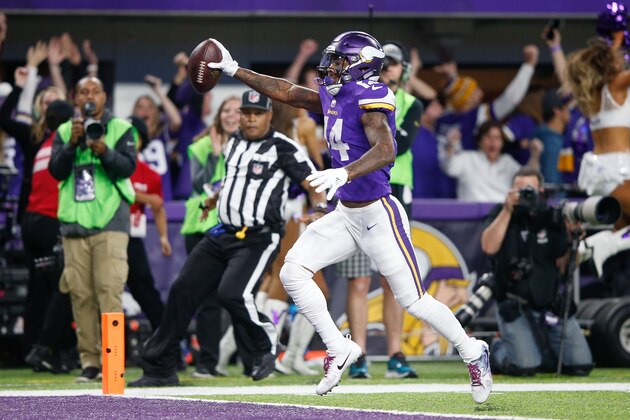 MINNEAPOLIS, MN - JANUARY 14:  Stefon Diggs #14 of the Minnesota Vikings scores a touchdown as time expires against the New Orleans Saints during the second half of the NFC Divisional Playoff game at U.S. Bank Stadium on January 14, 2018 in Minneapolis, Minnesota.  (Photo by Jamie Squire/Getty Images)