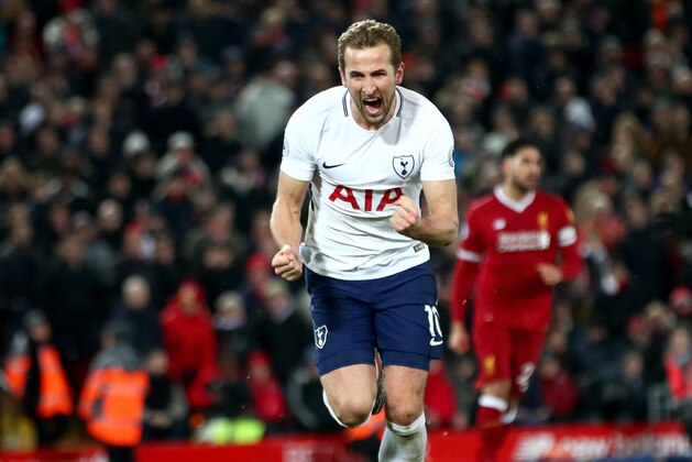 LIVERPOOL, ENGLAND - FEBRUARY 04:  Harry Kane of Tottenham Hotspur celebrates after scoring his sides second goal and his 100th Premier League goal during the Premier League match between Liverpool and Tottenham Hotspur at Anfield on February 4, 2018 in Liverpool, England.  (Photo by Clive Brunskill/Getty Images)