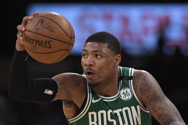 Boston Celtics guard Marcus Smart dribble the ball during the second half of an NBA basketball game against the Los Angeles Lakers, Tuesday, Jan. 23, 2018, in Los Angeles. The Lakers won 108-107. (AP Photo/Mark J. Terrill)