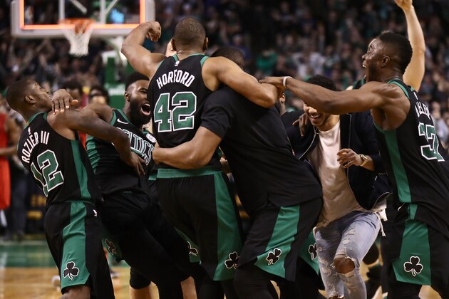 BOSTON, MA - FEBRUARY 04:  Al Horford #42 is mobbed by the rest of the Boston Celtics after scoring the game winning shot at the end of the game against the Portland Trail Blazers at TD Garden on February 4, 2018 in Boston, Massachusetts. NOTE TO USER: User expressly acknowledges and agrees that, by downloading and or using this photograph, User is consenting to the terms and conditions of the Getty Images License Agreement.  (Photo by Omar Rawlings/Getty Images)