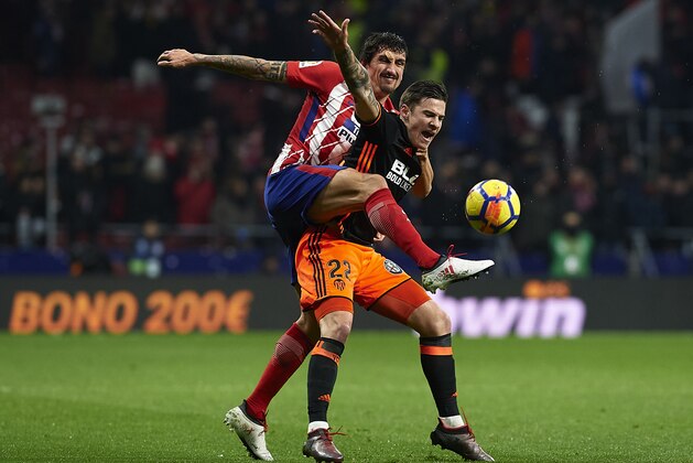 MADRID, SPAIN - FEBRUARY 04:  Stefan Savic of Atletico de Madrid competes for the ball with Santi Mina (R) of Valencia during the La Liga match between Atletico Madrid and Valencia CF at Wanda Metropolitano on February 4, 2018 in Madrid, Spain.  (Photo by Quality Sport Images/Getty Images)