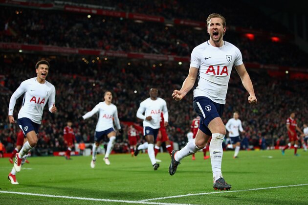 LIVERPOOL, ENGLAND - FEBRUARY 04:  Harry Kane of Tottenham Hotspur celebrates with team mates after scoring his sides second goal and his 100th Premier League goal  during the Premier League match between Liverpool and Tottenham Hotspur at Anfield on February 4, 2018 in Liverpool, England.  (Photo by Clive Brunskill/Getty Images)