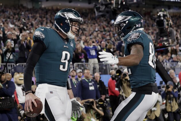 Philadelphia Eagles quarterback Nick Foles (9) celebrates a touchdown with wide receiver Torrey Smith (82), during the first half of the NFL Super Bowl 52 football game against the New England Patriots, Sunday, Feb. 4, 2018, in Minneapolis. (AP Photo/Tony Gutierrez)