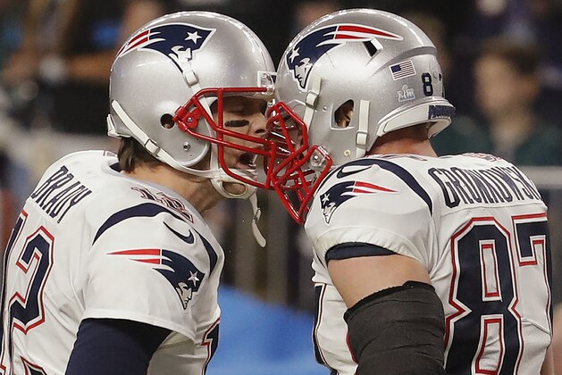 New England Patriots quarterback Tom Brady (12) and tight end Rob Gronkowski (87) celebrate a touchdown play, during the second half of the NFL Super Bowl 52 football game against the Philadelphia Eagles, Sunday, Feb. 4, 2018, in Minneapolis. (AP Photo/Charlie Neibergall)