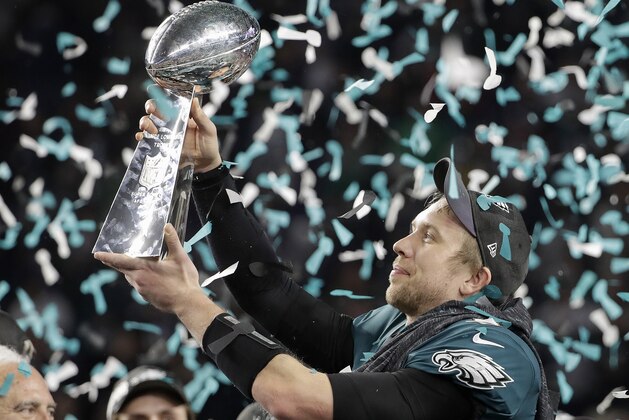 Philadelphia Eagles' Nick Foles holds up the Vince Lombardi Trophy after the NFL Super Bowl 52 football game against the New England Patriots, Sunday, Feb. 4, 2018, in Minneapolis. The Eagles won 41-33. (AP Photo/Chris O'Meara)
