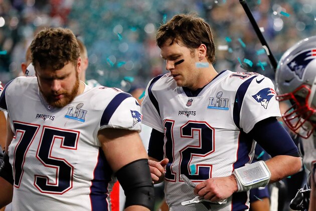 MINNEAPOLIS, MN - FEBRUARY 04:  Tom Brady #12 and Ted Karras #75 of the New England Patriots walk off the field after their teams 41-33 loss to the Philadelphia Eagles in Super Bowl LII at U.S. Bank Stadium on February 4, 2018 in Minneapolis, Minnesota. The Philadelphia Eagles defeated the New England Patriots 41-33.  (Photo by Kevin C. Cox/Getty Images)