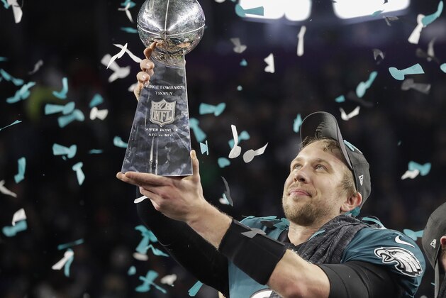 Philadelphia Eagles' Nick Foles holds up the Vince Lombardi Trophy after the NFL Super Bowl 52 football game against the New England Patriots Sunday, Feb. 4, 2018, in Minneapolis. The Eagles won 41-33. (AP Photo/Matt Slocum)