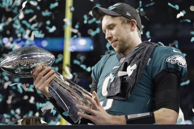 Philadelphia Eagles' Nick Foles holds up the Vince Lombardi Trophy after the NFL Super Bowl 52 football game against the New England Patriots, Sunday, Feb. 4, 2018, in Minneapolis. The Eagles won 41-33. (AP Photo/Mark Humphrey)