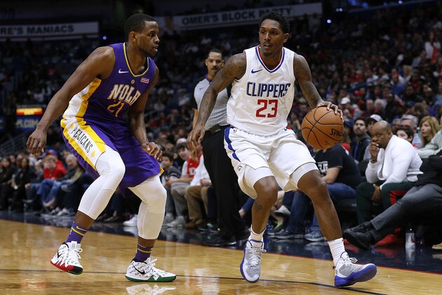 NEW ORLEANS, LA - JANUARY 28: Lou Williams #23 of the LA Clippers drives against Darius Miller #21 of the New Orleans Pelicans druing the second half at the Smoothie King Center on January 28, 2018 in New Orleans, Louisiana. NOTE TO USER: User expressly acknowledges and agrees that, by downloading and or using this photograph, User is consenting to the terms and conditions of the Getty Images License Agreement.  (Photo by Jonathan Bachman/Getty Images)