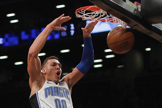 Orlando Magic forward Aaron Gordon (00) dunks the ball against the Brooklyn Nets during the first quarter of an NBA basketball game, Monday, Jan. 1, 2018, in New York. (AP Photo/Julie Jacobson)