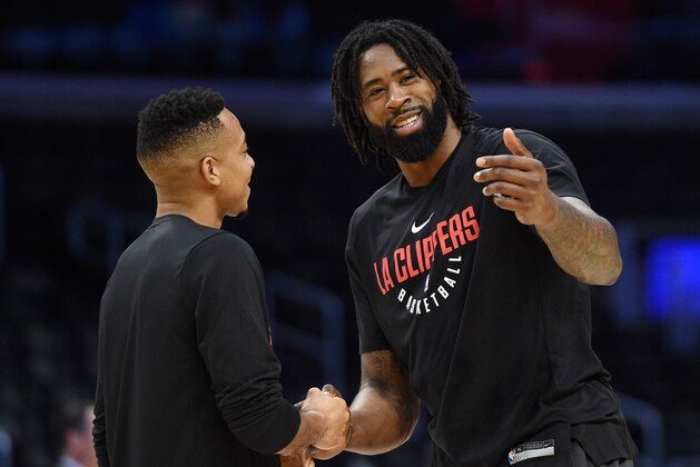 LOS ANGELES, CA - JANUARY 30: DeAndre Jordan #6 of the Los Angeles Clippers and CJ McCollum #3 of the Portland Trail Blazers greet during pre-game warm up prior to the start of a basketball at Staples Center on January 30, 2018 in Los Angeles, California. NOTE TO USER: User expressly acknowledges and agrees that, by downloading and or using this photograph, User is consenting to the terms and conditions of the Getty Images License Agreement. (Photo by Kevork Djansezian/Getty Images)