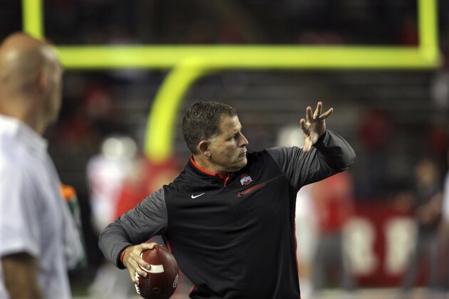 Former head coach of Rutgers football and head coach of the National Football League's Tampa Bay Buccaneers, now Ohio State associate head coach/ defensive coordinator Greg Schiano throws a ball before an NCAA college football game against Rutgers Saturday, Sept. 30, 2017, in Piscataway, N.J. (AP Photo/Mel Evans)