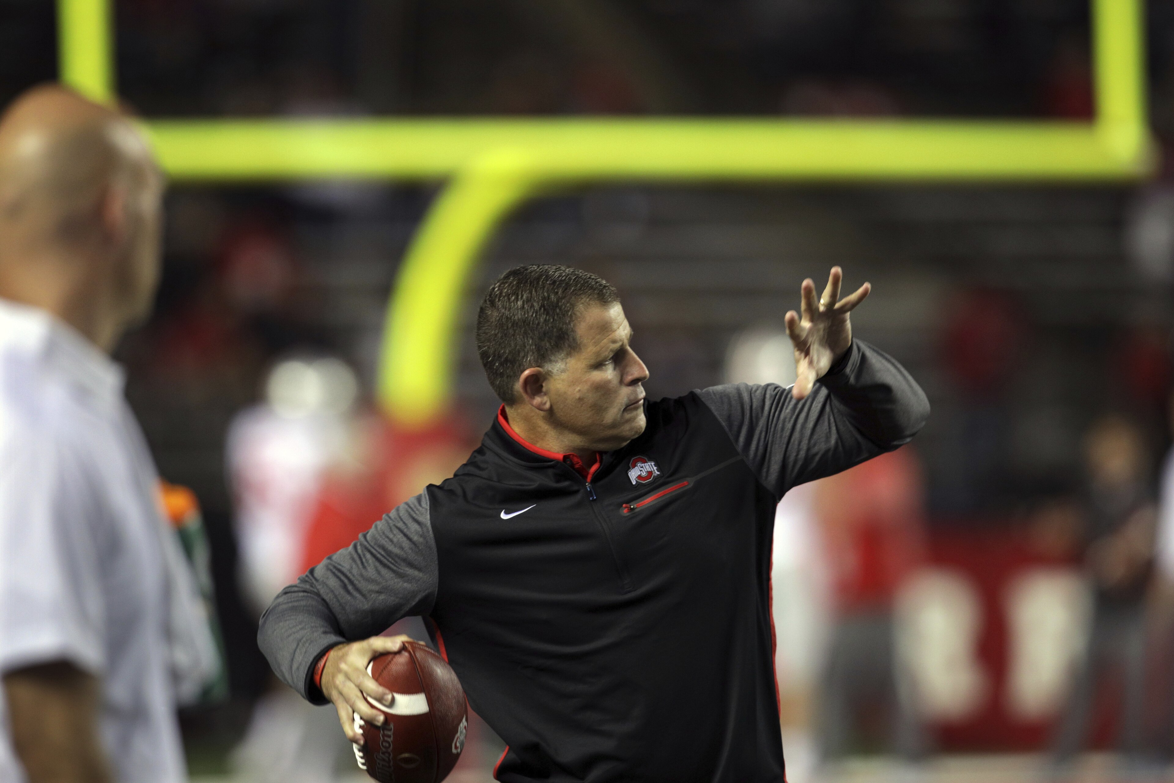 Former head coach of Rutgers football and head coach of the National Football League's Tampa Bay Buccaneers, now Ohio State associate head coach/ defensive coordinator Greg Schiano throws a ball before an NCAA college football game against Rutgers Saturday, Sept. 30, 2017, in Piscataway, N.J. (AP Photo/Mel Evans)